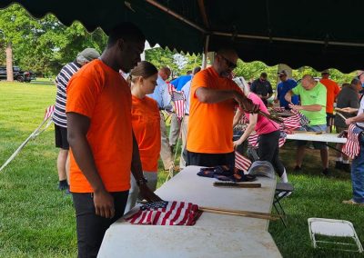 volunteers assembling american flags